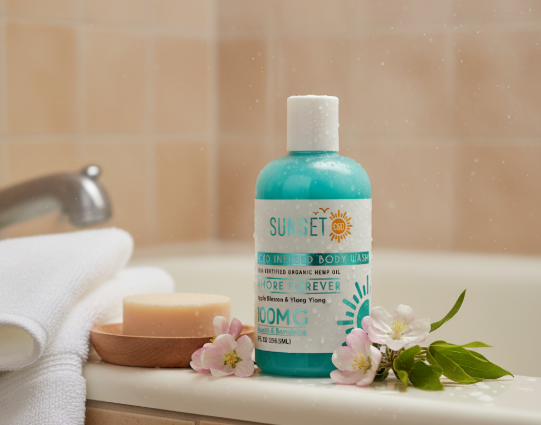 Lifestyle image of Sunset CBD Amore Forever Body Wash 100mg – soothing CBD bath product with floral scent, shown with towels and flowers