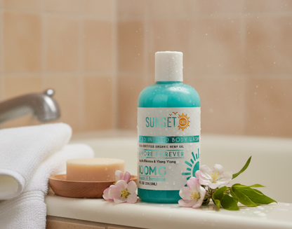 Lifestyle image of Sunset CBD Amore Forever Body Wash 100mg – soothing CBD bath product with floral scent, shown with towels and flowers